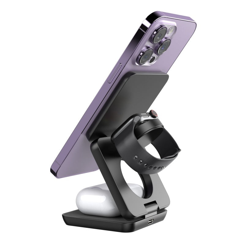 Folding Magnetic Charging Stand charging a phone, watch and earbuds