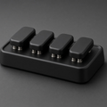 Four-Key Clicker, matte black, on graphite