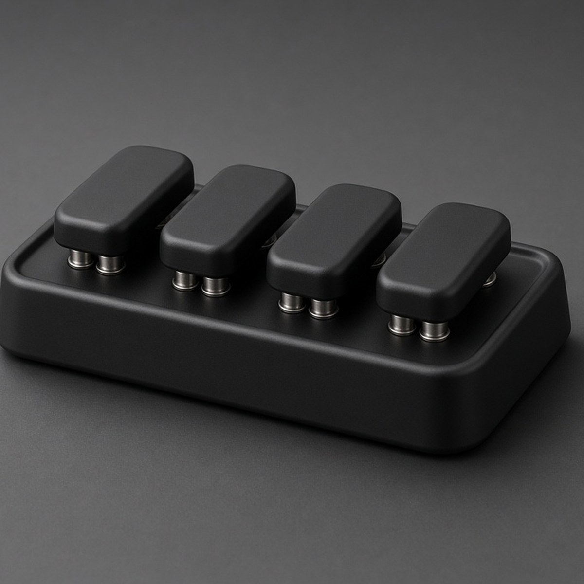 Four-Key Clicker, matte black, on graphite