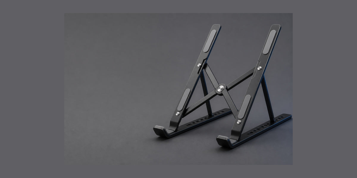 Folding laptop stand, matte black, on graphite